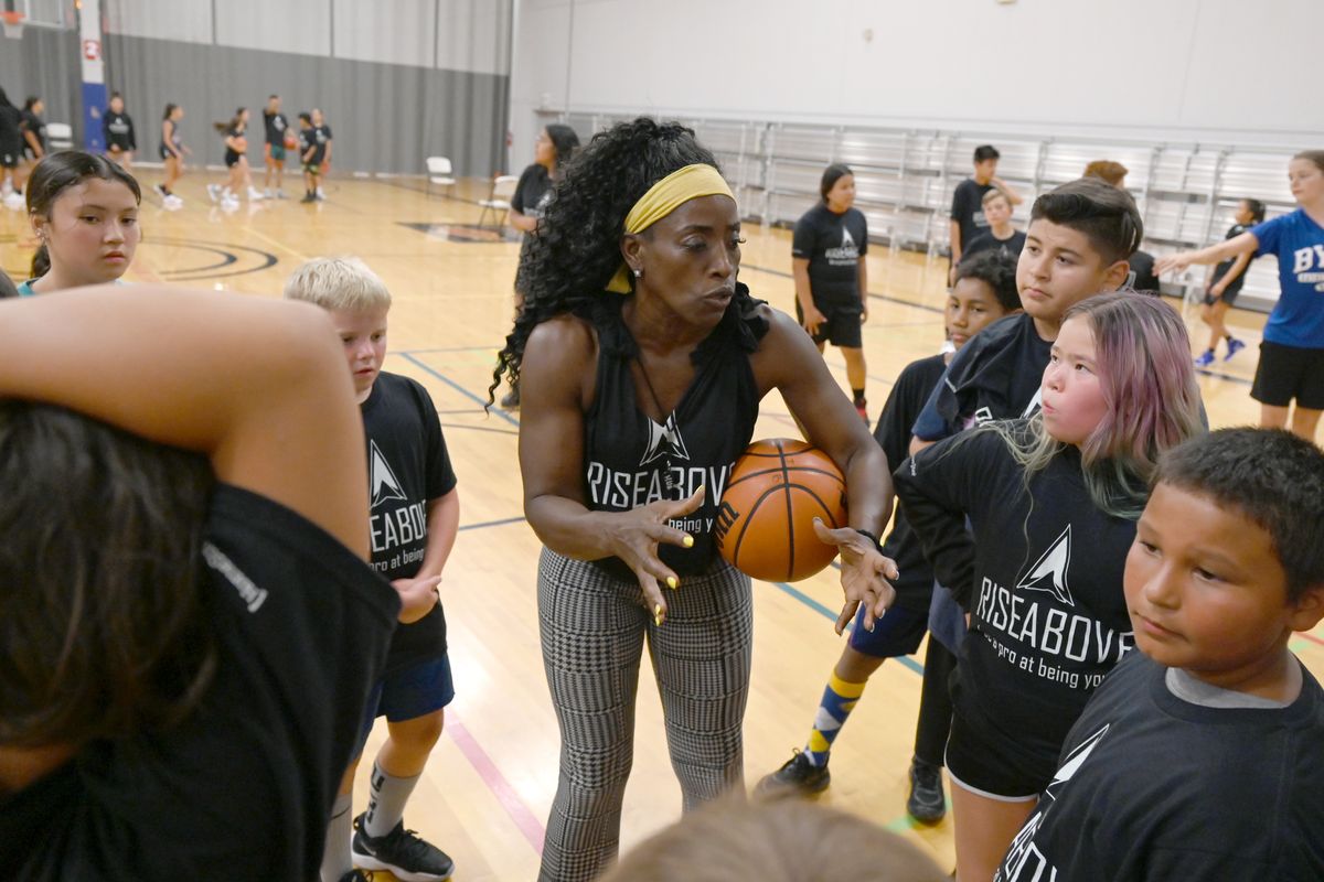 Two-time Olympian Ruthie Bolton coaches some of the participants in the Rise Above basketball camp at the Hub Sports Center Monday, July 12, 2021. The free camp was aimed at Native youth and paid for by donations.  (Jesse Tinsley/The Spokesman-Review)