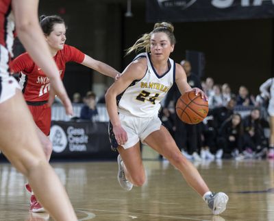 Mead’s Teryn Gardner looks to go around the defense of Snohomish’s Cora Larson during the 2024 State 3A semifinal at the Tacoma Dome. (Patrick Hagerty/For The Spokesman-Review)