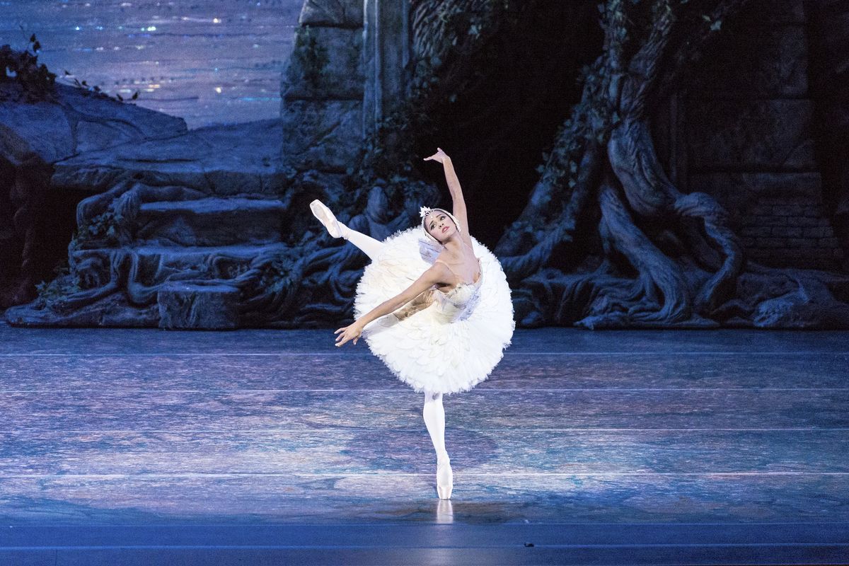 Misty Copeland performs in “Swan Lake” in 2014 at the Queensland Performing Arts Centre in Queensland, Australia. Below: Copeland acknowledges the audience after appearing in “Swan Lake” at the Metropolitan Opera House in New York last week. (Associated Press)