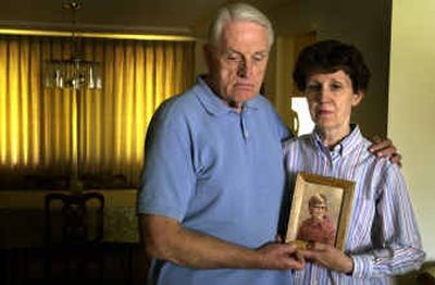 
Terry and Ann Corrigan hold a picture of their son, Tim, at about the age he was allegedly sexually abused by Father Patrick O'Donnell. Corrigan committed suicide two years ago.
 (Jed Conklin / The Spokesman-Review)