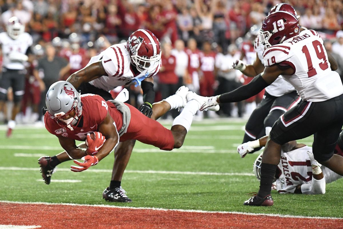 Washington State Cougars wide receiver Easop Winston Jr. (8) dives into the end zone for a touchdown during the first half of a college football game on Saturday, August 31, 2019, at Martin Stadium in Pullman, Wash. (Tyler Tjomsland / The Spokesman-Review)
