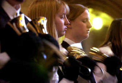 
Mindi Vetter, 16, left, and Sarah Tupper, 16, of the Spokane Valley Adventist School Handbell Choir perform their solo, 