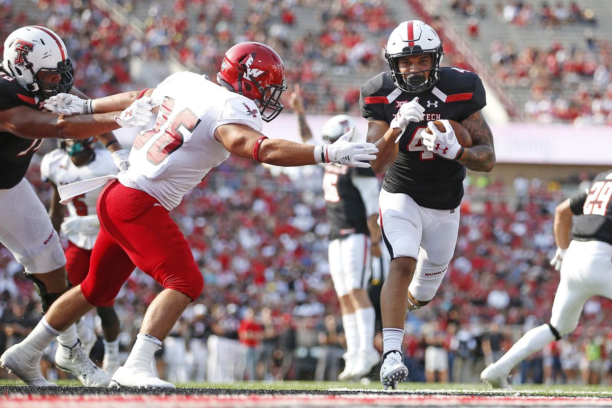 Texas Tech’s Justin Stockton (4) runs past Eastern Washington