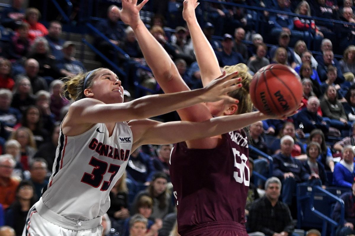 Gonzaga forward Melody Kempton (33) gleans into the key as she shoots the ball underhanded past Missouri State center Emily Gartner (50) during the first half of a college basketball game, Fri., Dec. 20, 2019, at the McCarthey Athletic Center. (Colin Mulvany / The Spokesman-Review)