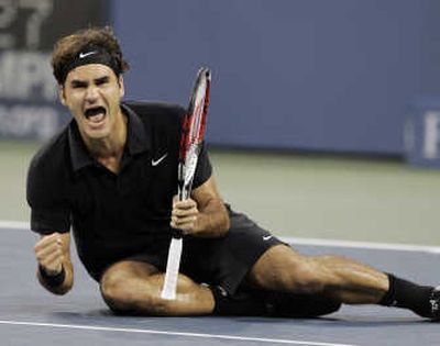 
Roger Federer celebrates his 12th major championship. Associated Press
 (Associated Press / The Spokesman-Review)