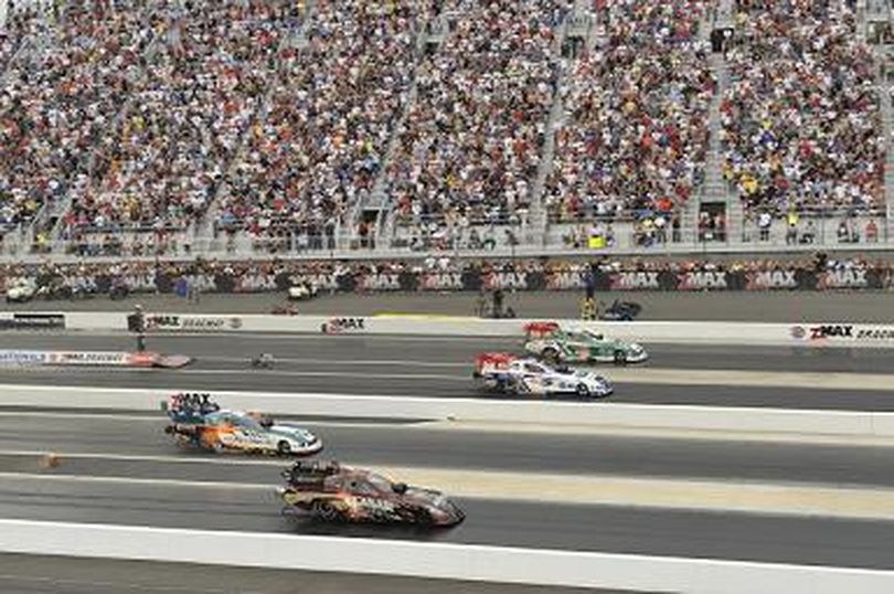 Four wide drag racing NHRA Full Throttle Funny Car style at zMax Dragway in Charlotte, NC. (Photo courtesy of NHRA) (The Spokesman-Review)