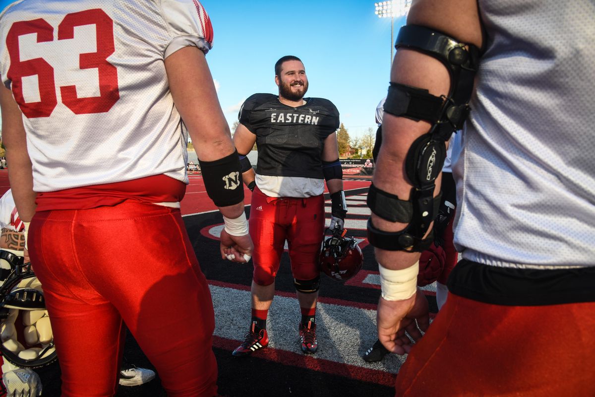 Eastern Washington center Spencer Blackburn converses with teammates before practice Nov. 7, 2017, in Cheney. He is the anchor of the Eagles’ offensive line. (Dan Pelle / The Spokesman-Review)