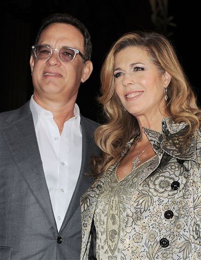 FILE - In this Nov. 9, 2009 file photo, Tom Hanks, left, and his wife Rita Wilson arrive to the premiere of Old Dogs in Los Angeles. (Katy Winn / Winnk)