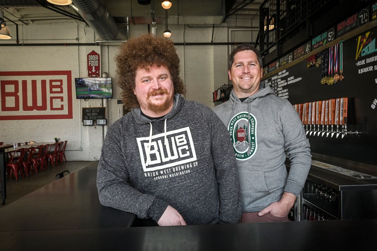 Operations manager Brian Carpenter, left, and owner Jordan Tampien have major expansion plans for Brick West Brewing Co. that include creation of a new brewing hub and taproom near Spokane International Airport.  (DAN PELLE/THE SPOKESMAN-REVIEW)