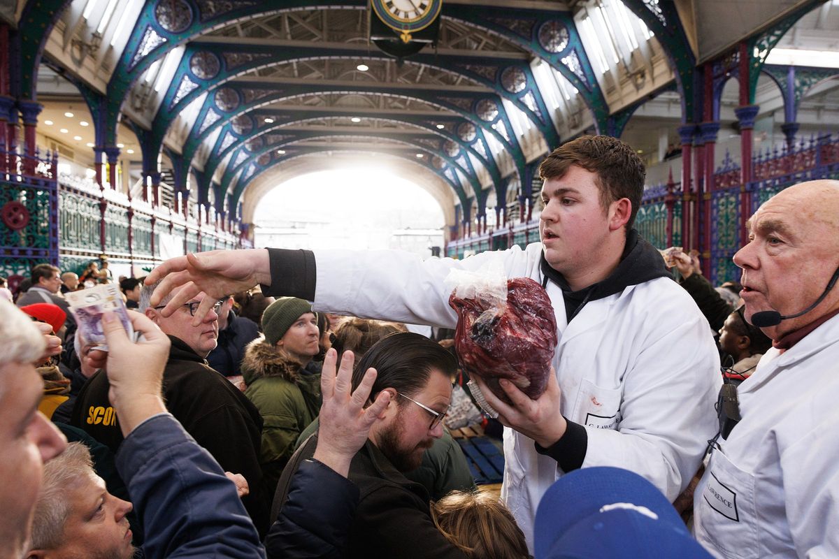 LONDON, ENGLAND - DECEMBER 23: Joints of meat are sold to customers during the annual Harts