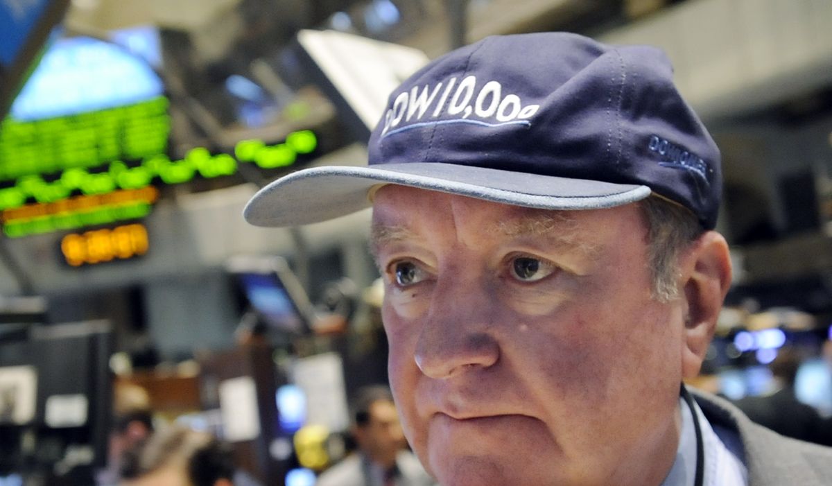 Executive floor governor Arthur Cashin, with UBS Financial Services, wears his Dow 10,000 hat on the floor of the New York Stock Exchange on Tuesday. (Richard Drew / The Spokesman-Review)