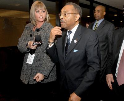 U.S. Sen. Roland Burris walks past reporters on Tuesday in Bloomington, Ill. (Associated Press / The Spokesman-Review)