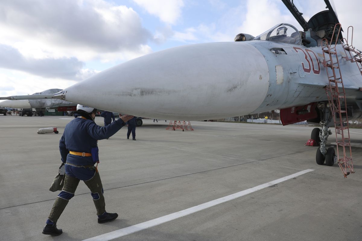 A Russian air force pilot walks to aSu-30 fighter jet before a training mission in Krasnodar Region, Russia, Wednesday, Jan. 19, 2022.  (Vitaliy Timkiv)