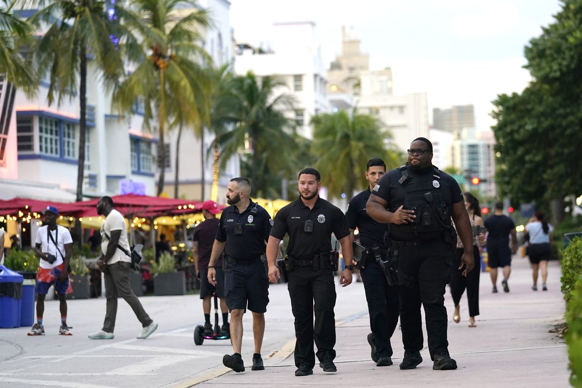 City of Miami Beach code enforcement and police officers patrol along Ocean Drive, Friday, Sept. 24, 2021, in Miami Beach, Fla. For decades, this 10-block area has been one of the most glamorized spots in the world, made cool by TV shows like Miami Vice, where the sexiest models gathered at Gianni Versace