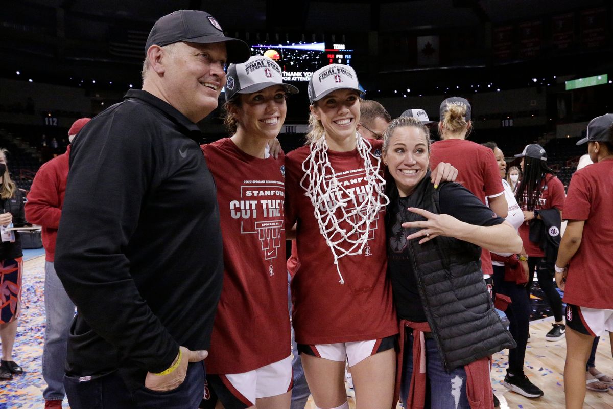 Stanford guards and twin sisters Lacie Hull, second from left, and Lexie Hull, second from right, pose for a photo with their parents, Jason and Jaime Hull, of Liberty Lake, Wash., after a college basketball game against Texas in the Elite 8 round of the NCAA tournament, Sunday, March 27, 2022, in Spokane, Wash. Stanford won 59-50.   (Associated Press)