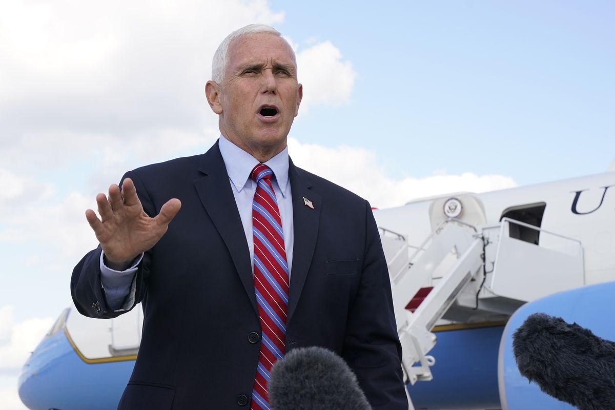 Vice President Mike Pence speaks to members of the media at Andrews Air Force Base, Md., Monday, Oct. 5, 2020, as he leaves Washington for Utah ahead of the vice presidential debate schedule for Oct. 7.  (Jacquelyn Martin)