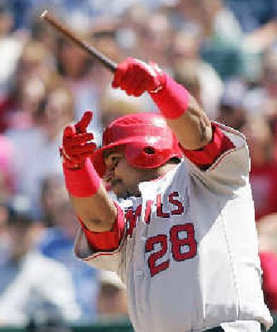 
Los Angeles Angels' Jose Molina holds onto what's left of his bat after hitting an RBI single against Seattle during the sixth inning. The seven runs in the inning were the most for Los Angeles this season.
 (Associated Press / The Spokesman-Review)