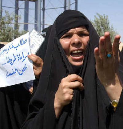
Iraqi female police officers in Najaf demand back pay from the local government during a protest on Sunday. 
 (Associated Press / The Spokesman-Review)