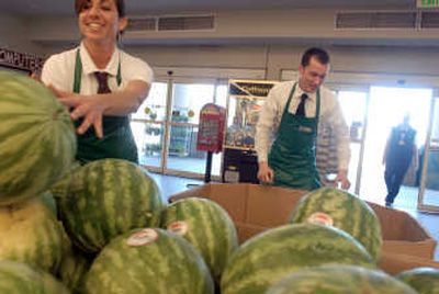 
Karen Crowe and Anthony Jacobs stock up on watermelons at Super 1 Foods for Rathdrum Days. 
 (Photo by Jesse Tinsley / The Spokesman-Review)