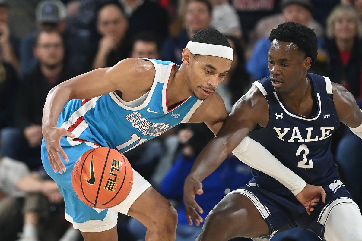 Gonzaga guard Nolan Hickman (11) dribbles the ball as Yale guard Bez Mbeng (2) defends during the second half of a NCAA college basketball game, Friday, Nov. 10, 2023, in the McCarthey Athletic Center.  (COLIN MULVANY/THE SPOKESMAN-REVIEW)