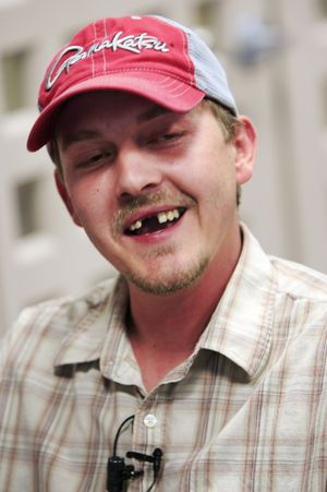 Lottery winner Christopher Shaw, 29, smiles while talking with reporters following a ceremony at the Missouri Lottery offices Thursday, April 22, 2010, in Jefferson City, Mo. (Orlin Wagner / Associated Press)