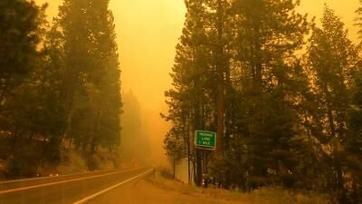 Some 14,000 firefighters face rising heat and dropping humidity as they battle more than a dozen large wildfires across California, including the Caldor Fire, a growing blaze that was slowly pushing toward the Lake Tahoe resort region. 