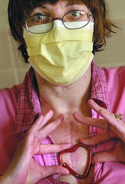 
Kathy Cochran displays a heart-shaped keychain that  her niece gave her while she awaited a new heart. 
 (Brian Plonka / The Spokesman-Review)