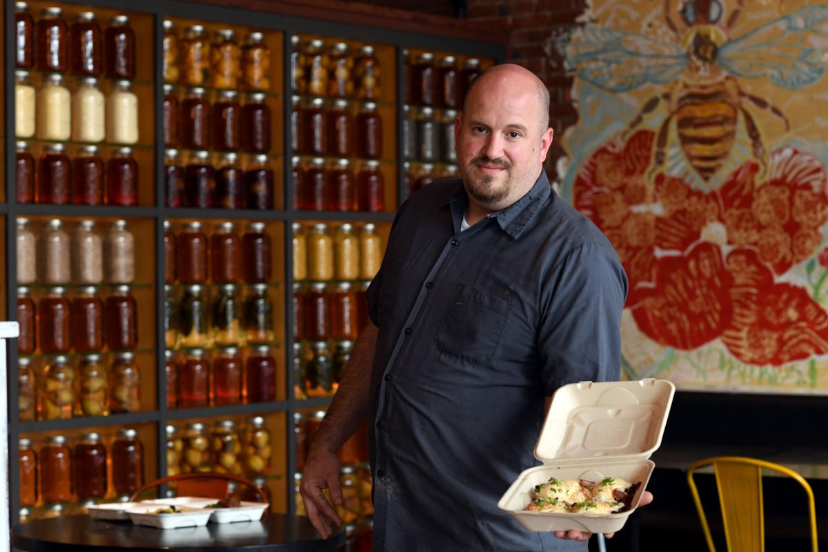 Chef Justin Klauba displays the Eggs Benedict portion of the Mother