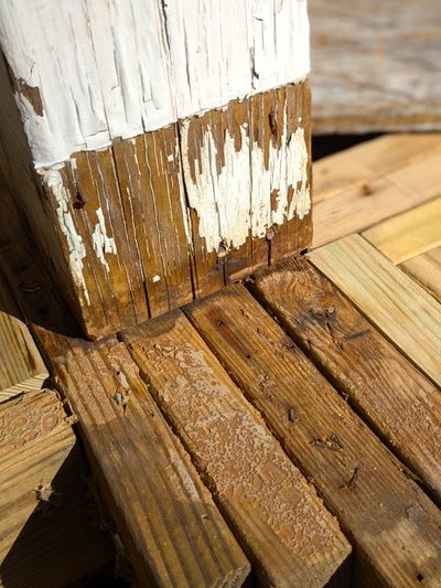 The paint failure at the bottom of this wood post can be traced to the hidden cut edge that is sitting on the treated lumber. The odds are the cut edge is bare wood. (Tribune Content Agency)