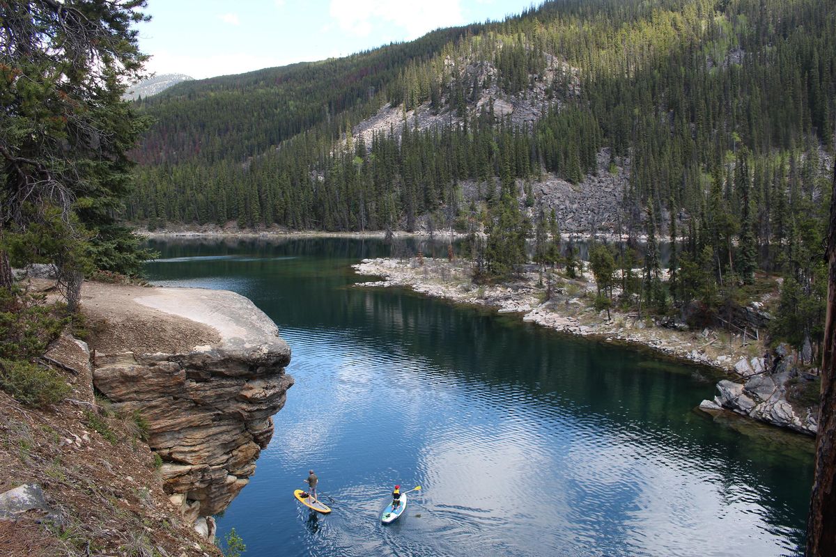 At left: Horseshoe Lake, a favorite of swimmers who sometimes dive off its rocky outcrops, also draws a variety of paddlers to its placid waters. (Alan Solomon / TNS)