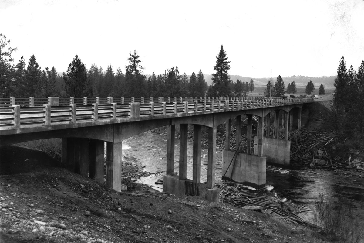 1951: The Spokane Valley Chamber of Commerce formally dedicated the new Sullivan Road Bridge connecting the corridors of Sprague Avenue and Trent Road. The photo looks northwestward toward the Trentwood aluminum rolling mill and the naval supply depot. The bridge and other improvements to the north-south arterial eased commuter congestion and improved access through the fast-growing Spokane Valley.  (Spokesman-Review Photo Archives)