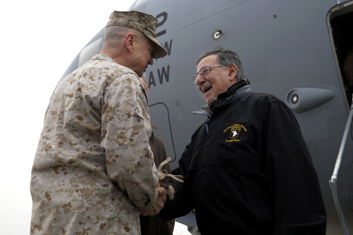 U.S. Defense Secretary Leon Panetta, right, is greeted by Marine Gen. John R. Allen, left, commander of International Security Assistance Force, upon his arrival at Kabul International Airport in Kabul, Afghanistan, Wednesday, Dec. 12, 2012. Panetta is expected to meet with troops as part of a holiday visit to thank the troops for their service. (Susan Walsh / Ap Pool)