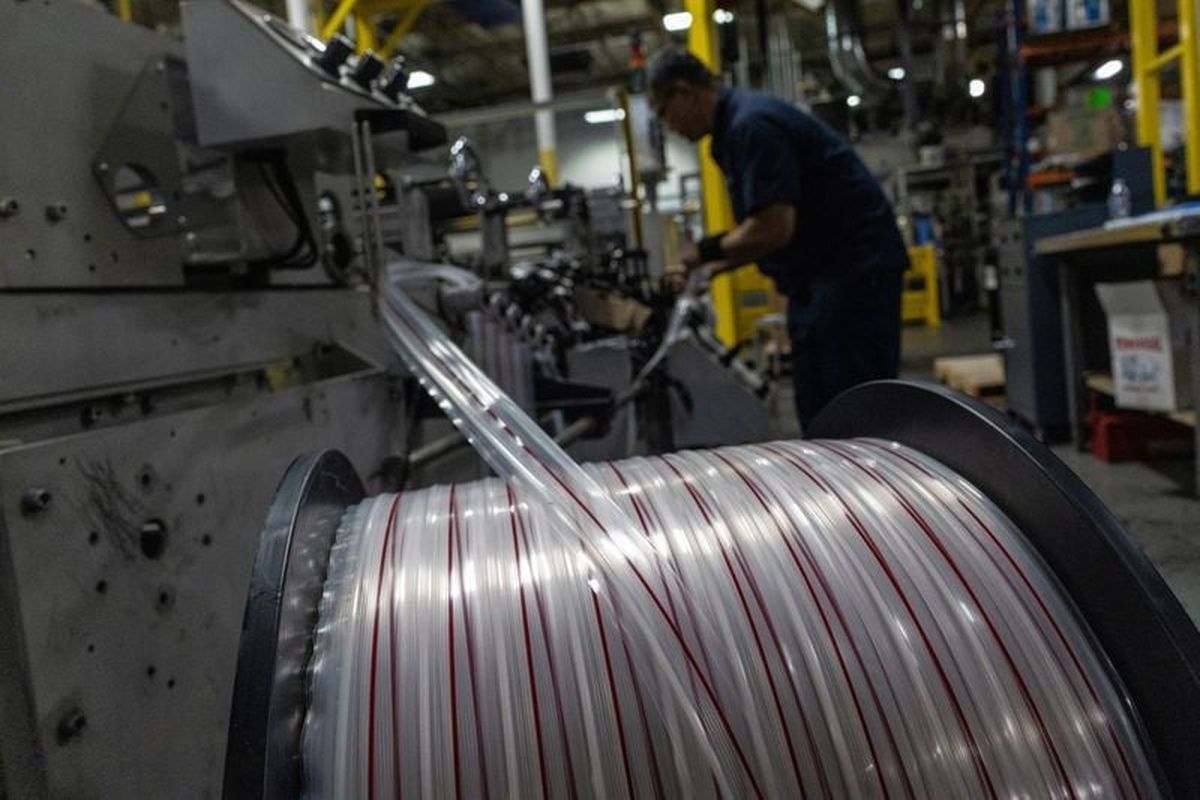 An employee at Emerald Packaging operates a machine that produces grocery bags at the company’s facility on Monday in Union City, Calif.  (Reuters )