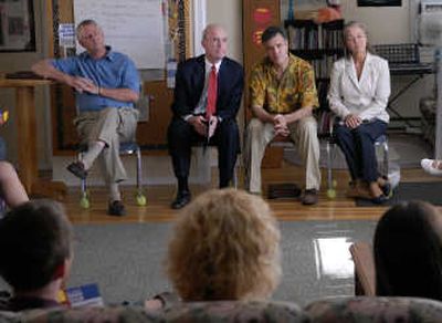 
Councilman Al French, Mayor Dennis Hession, mayoral candidate Mike Noder and  Councilwoman Mary Verner listen to a question during  a mayor candidates debate Tuesday at  Odyssey Youth Center. 
 (Dan Pelle / The Spokesman-Review)