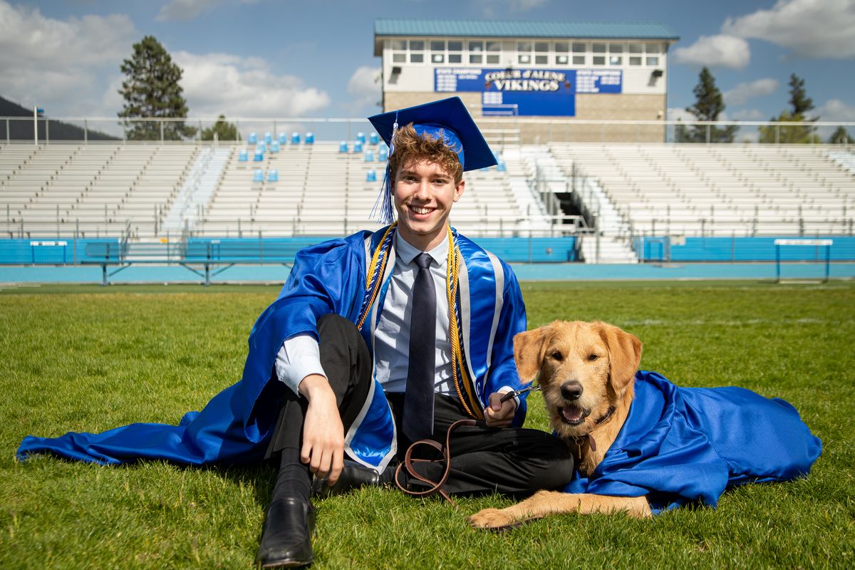 Senior Carson Magee is Coeur d’Alene High School’s notable grad for the class of 2021. Magee has Type 1 diabetes and began training Capo, a goldendoodle-lab mix, eight weeks after Capo was born; now the dog is 14 months old and outfitted with his own custom-made gown from Jostens for graduation alongside Magee. The senior is editor of Coeur d’Alene High School’s yearbook, The Viking, but plans to pursue a career in computer science or human-computer interaction. (Libby Kamrowski/ THE SPOKESMAN-REVIEW)