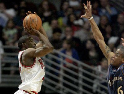 Chicago's Ben Gordon hits one of his NBA-record-tying nine 3-pointers without a miss over Wizard Antonio Daniels.
(Associated Press / The Spokesman-Review)