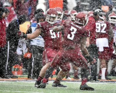 WSU’s Destiny Vaeao, left, and Ivan McClennan  dance in celebration after forcing Miami to punt in the 2015 Sun Bowl. (Tyler Tjomsland / The Spokesman-Review)