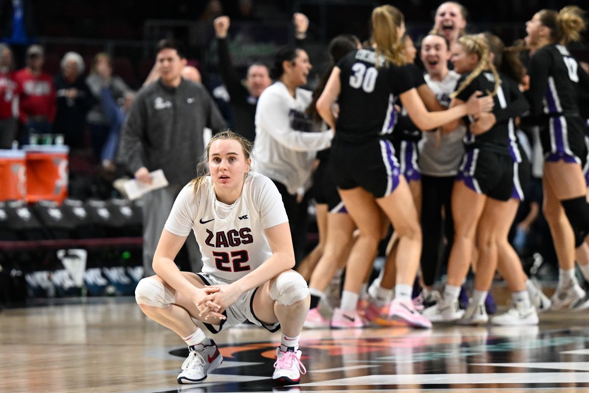 Gonzaga Bulldogs guard Brynna Maxwell (22) reacts as time expires and the Portland Pilots celebrate defeating the Gonzaga Bulldogs during the second half of a WCC women’s championship basketball game on Tuesday, Mar 12, 2024, at Orleans Arena in Las Vegas, Nev. Portland won the game 67-66.  (Tyler Tjomsland/The Spokesman-Review)