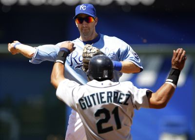 Royals’ Willie Bloomquist gets a double play over M’s Franklin Gutierrez.  (Associated Press / The Spokesman-Review)