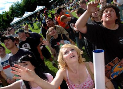 
Teri Marshall, 17, throws her arms in the air during the BOBfest competition on Saturday in Riverfront Park. BOBfest brought local bands to the park to battle it out for the opportunity to play during First Night Spokane. 
 (Photos by Amanda Smith / The Spokesman-Review)