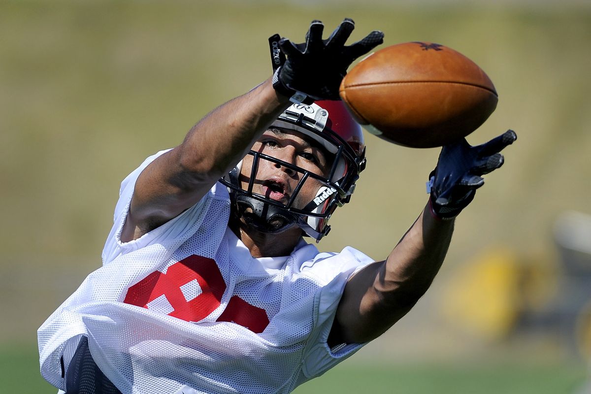 Eastern wide receiver Jalani Phelps makes a reception during the first day of football practice, Thursday, July, 31, 2014, at Eastern Washington University. (Colin Mulvany / The Spokesman-Review)