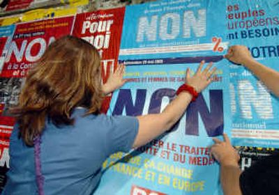 
Students put up campaign posters in reference to the referendum on the EU constitution in a street of Aix-en-Provence, France, on Thursday. France votes on the constitution in a referendum this Sunday.
 (Associated Press / The Spokesman-Review)