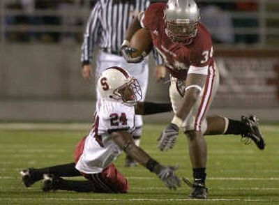 
Washington State running back Chris Ivory skips past Stanford's Kris Evans during Saturday's game at Martin Stadium. 
 (Christopher Anderson / The Spokesman-Review)