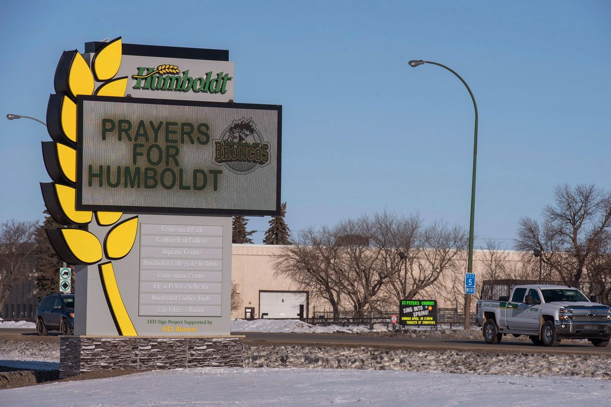 A pick-up truck drives by the welcome sign honoring the members of the Humboldt Broncos hockey team in Humboldt, Saskatchewan, Canada, Saturday, April 7, 2018. Canadian police said early Saturday that several people were killed and others injured after a truck collided with a bus carrying the junior hockey team to a playoff game in Western Canada. Police say there were 28 people, including the driver, on board the bus of the Humboldt Broncos team when the crash occurred around 5 p.m. Friday on Highway 35 in Saskatchewan. (Liam Richards / Canadian Press via AP)