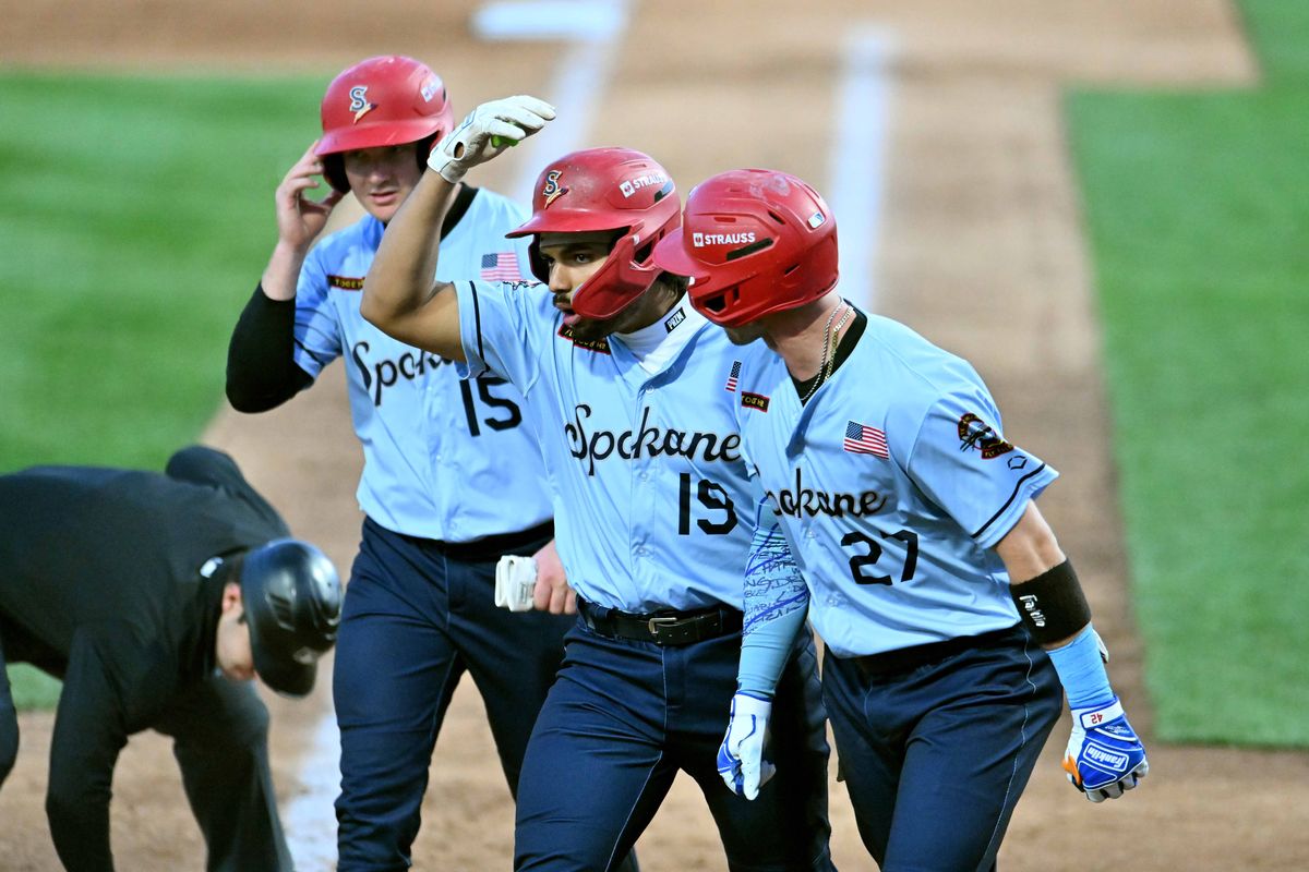 Spokane Indians catcher Alan Espinal (center) celebrates his three-run home run in the sixth inning against the Tri-City Dust Devils at Avista Stadium on May 8, 2026.  (James Snook)