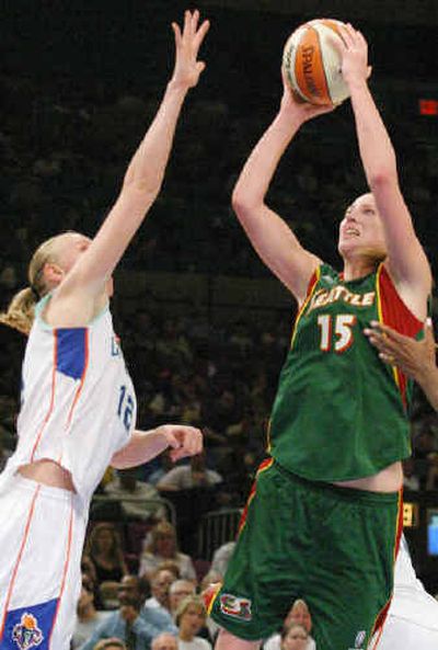 
Seattle's Lauren Jackson shoots over Ann Wauters as the Storm routed New York.
 (Associated Press / The Spokesman-Review)