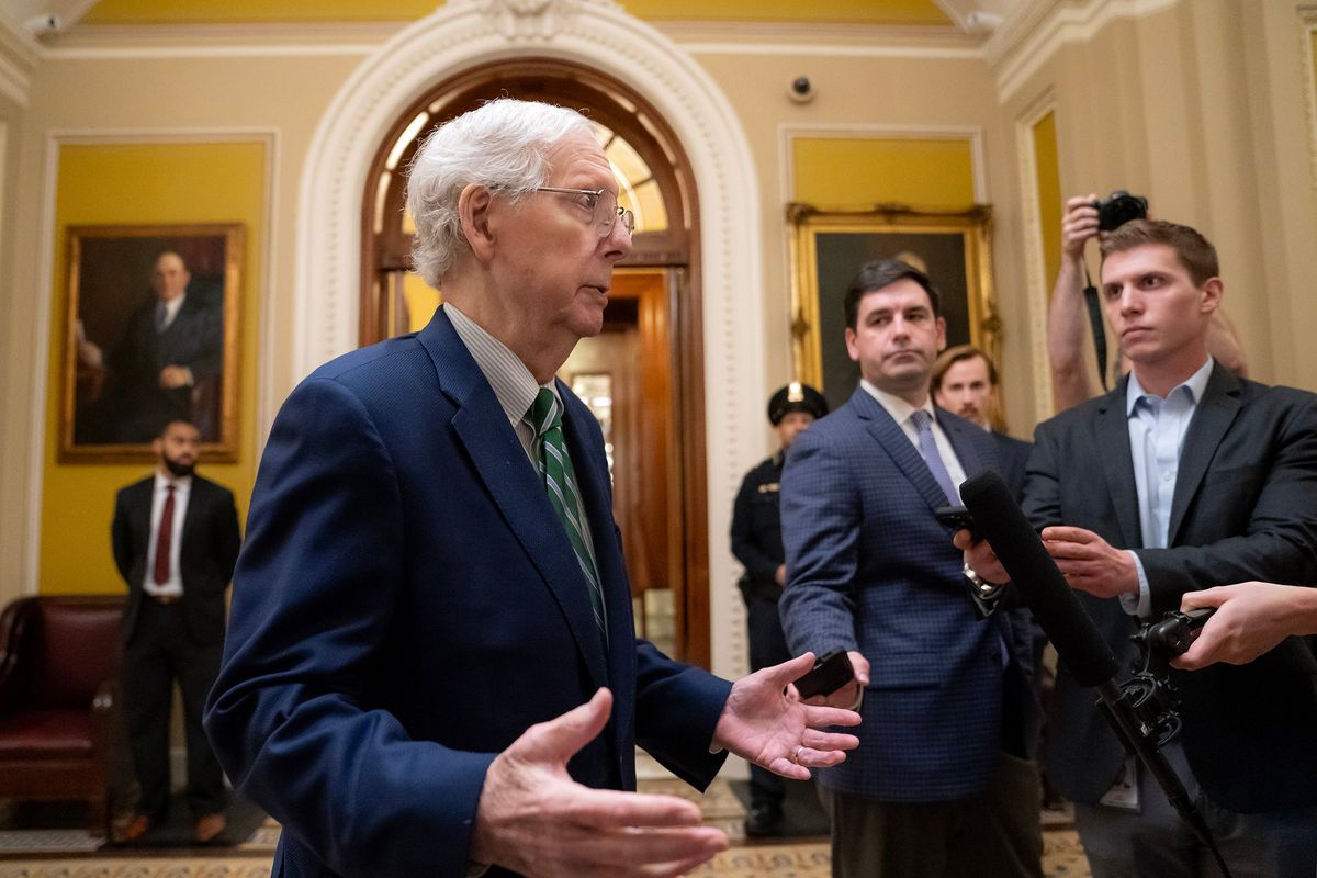 U.S. Senate Minority Leader Mitch McConnell (R-Ky.) speaks with members of the media following passage of a short-term funding bill on Saturday in Washington, D.C.  (Nathan Howard)