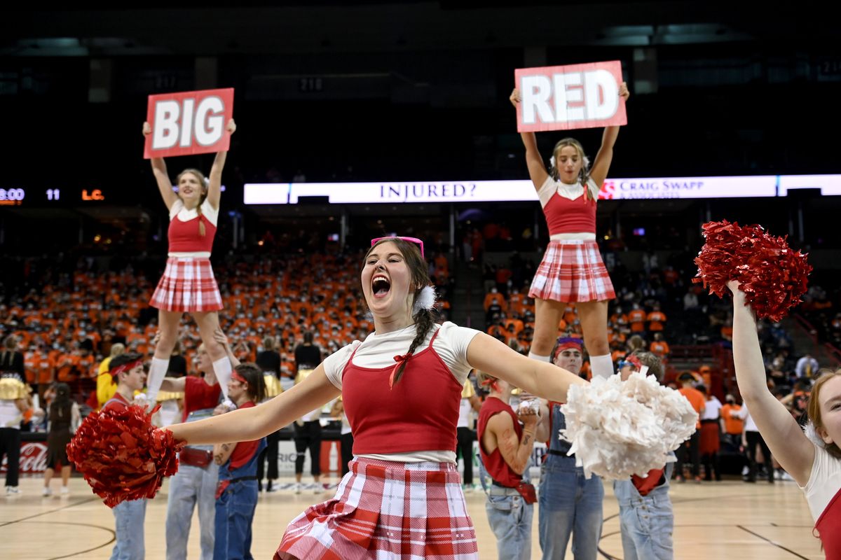 Ferris cheerleader Meriaya Cargile,16, helps wind up the noise from the Saxon student section during the annual Rubber Chicken high school basketball spirit game, Monday, Feb. 7, 2022, in the Spokane Arena.  (COLIN MULVANY/THE SPOKESMAN-REVIEW)
