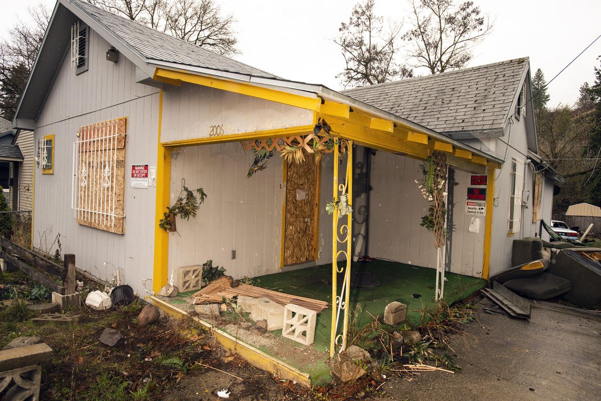 The number of abandoned properties, like this one at 2006 E. Hartson Ave., is on the rise in Spokane. The state Legislature has passed a bill making these properties appear on a list. This gives the city the ability to work with banks and owners to either clean up properties or force banks into action. (Colin Mulvany / The Spokesman-Review)