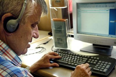 
John Croy uses JAWS software, a program that helps sight-impaired people access popular computer software applications and the Internet, to check his e-mail at North Spokane Library recently
 (Holly Pickett / The Spokesman-Review)